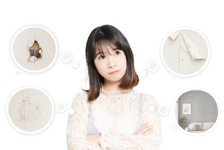 壁紙の穴や剥がれ、汚れについて悩んでいる女性